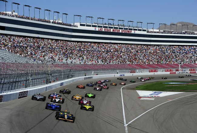 LAS VEGAS - SEPTEMBER 15:  Tony Kanaan of Brazil driver of the #82 KV Racing Technology Dallara Honda leads the field at the start of the Las Vegas Indy 300 part of the IZOD IndyCar World Championships presented by Honda on September 15, 2011 at the Las Vegas Motor Speedway in Las Vegas, Nevada.  (Photo by Robert Laberge/Getty Images)