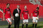 MANCHESTER, ENGLAND - AUGUST 14:  Sir Alex Ferguson, Dimitar Berbartov, Wayne Rooney and Michael Owen of Manchester United launch the Betfair Goal Challenge as part of Betfair's new partnership with Manchester United at Old Trafford on August 14 2009 in Manchester, England. (Photo by Tom Purslow/Manchester United via Getty Images)
