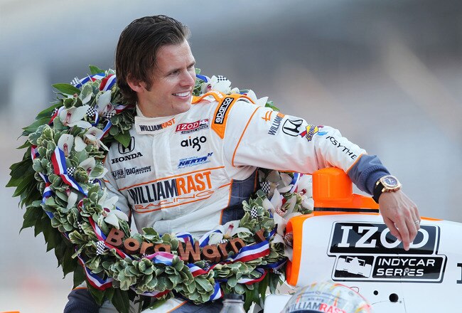 INDIANAPOLIS, IN - MAY 30:  Dan Wheldon of England, driver of the #98 William Rast-Curb/Big Machine Dallara Honda waits at his car during the 95th Indianapolis 500 Mile Race Trophy Presentation at Indianapolis Motor Speedway on May 30, 2011 in Indianapolis, Indiana.  (Photo by Nick Laham/Getty Images)
