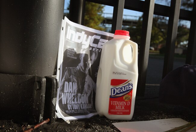 INDIANAPOLIS, IN - OCTOBER 17:  A jug of milk is sits at the gate of the Indianapolis Motor Speedway along with other tributes left by fans to two-time Indianapolis 500 winner Dan Wheldon on October 17, 2011 in Indianapolis, Indiana. Wheldon, winner of the 2011 Indy 500, was killed in a crash yesterday at the Izod IndyCar series season finale at Las Vegas Motor Speedway.  (Photo by Scott Olson/Getty Images)