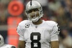 HOUSTON - OCTOBER 09: Quarterback Jason Campbell #8 of the Oakland Raiders during action against the Houston Texans at Reliant Stadium on October 9, 2011 in Houston, Texas. (Photo by Bob Levey/Getty Images)
