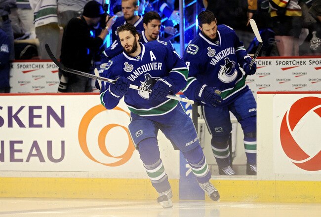 VANCOUVER, BC - JUNE 04:  Ryan Kesler #17 and Kevin Bieksa #3 of the Vancouver Canucks take to the ice prior to playing against the Boston Bruins in Game Two of the 2011 NHL Stanley Cup Final at Rogers Arena on June 4, 2011 in Vancouver, British Columbia, Canada.  (Photo by Harry How/Getty Images)