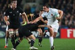 AUCKLAND, NEW ZEALAND - SEPTEMBER 24:  Louis Picamoles of France hands off Piri Weepu of the All Blacks during the IRB 2011 Rugby World Cup Pool A match between New Zealand and France at Eden Park on September 24, 2011 in Auckland, New Zealand.  (Photo by Sandra Mu/Getty Images)
