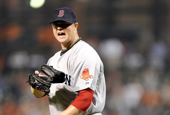 BALTIMORE, MD - SEPTEMBER 28:  Jon Lester #31 of the Boston Red Sox celebrates after the final out in the sixth inning against the Baltimore Orioles at Oriole Park at Camden Yards on September 28, 2011 in Baltimore, Maryland.  (Photo by Greg Fiume/Getty Images)