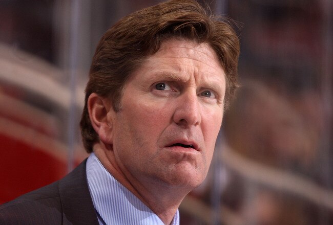 GLENDALE, AZ - OCTOBER 22:  Head coach Mike Babcock of the Detroit Red Wings watches from the bench during the NHL game against the Phoenix Coyotes at Jobing.com Arena on October 22, 2009 in Glendale, Arizona. The Coyotes defeated the Red Wings 3-2 in overtime.  (Photo by Christian Petersen/Getty Images)