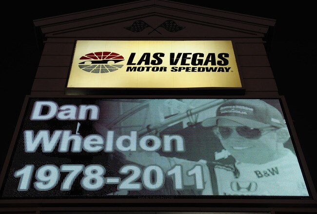 LAS VEGAS - OCTOBER 17:  A memorial to Dan Wheldon, driver of the #77 Bower & Wilkins Sam Schmidt Motorsports Dallara Honda, is displayed on a Las Vegas Motor Speedway sign on October 17, 2011 in Las Vegas, Nevada. Wheldon was killed during the Las Vegas Indy 300 part of the IZOD IndyCar World Championships presented by Honda at Las Vegas Motor Speedway on October 16, 2011. (Photo by Robert Laberge/Getty Images)