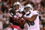 EAST RUTHERFORD, NJ - OCTOBER 17:   Antonio Cromartie #31 of the New York Jets battles for the ball against  Brandon Marshall #19 of the Miami Dolphins during the third quarter at MetLife Stadium on October 17, 2011 in East Rutherford, New Jersey.  (Photo by Nick Laham/Getty Images)