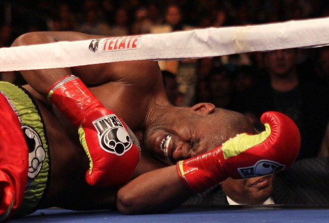 LOS ANGELES, CA - OCTOBER 15:  Bernard Hopkins lies on the canva in pain after falling and injuring his shoulder in the second round against Chad Dawson in their WBC and Ring Magzine light heavyweight title fight at Staples Center on October 15, 2011 in Los Angeles, California. Hopkins was unable to continue and Dawson was awarded a TKO victory.   (Photo by Stephen Dunn/Getty Images)