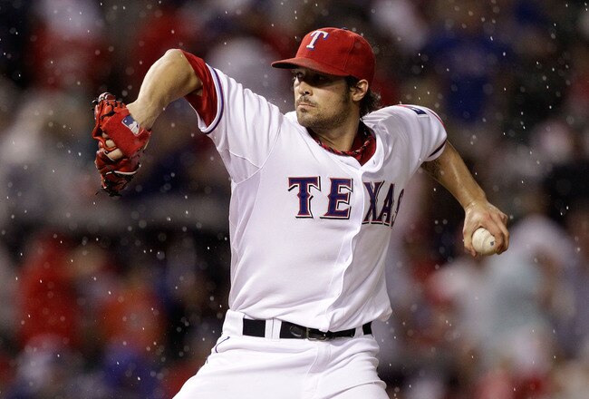ARLINGTON, TX - OCTOBER 08:  C.J. Wilson #36 of the Texas Rangers throws a pitch against the Detroit Tigers in Game One of the American League Championship Series at Rangers Ballpark in Arlington on October 8, 2011 in Arlington, Texas.  (Photo by Bob Levey/Getty Images)