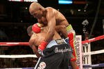 LOS ANGELES, CA - OCTOBER 15:  Bernard Hopkins (R) tangles with Chad Dawson as he falls to the canvas  in their WBC and Ring Magzine light heavyweight title fight at Staples Center on October 15, 2011 in Los Angeles, California. Hopkins injured his shoulder and was unable to continue and Dawson was awarded a TKO victory.  (Photo by Stephen Dunn/Getty Images)