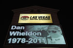 LAS VEGAS - OCTOBER 17:  A memorial to Dan Wheldon, driver of the #77 Bower & Wilkins Sam Schmidt Motorsports Dallara Honda, is displayed on a Las Vegas Motor Speedway sign on October 17, 2011 in Las Vegas, Nevada. Wheldon was killed during the Las Vegas Indy 300 part of the IZOD IndyCar World Championships presented by Honda at Las Vegas Motor Speedway on October 16, 2011. (Photo by Robert Laberge/Getty Images)