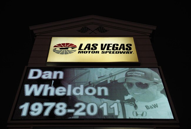 LAS VEGAS - OCTOBER 17:  A memorial to Dan Wheldon, driver of the #77 Bower & Wilkins Sam Schmidt Motorsports Dallara Honda, is displayed on a Las Vegas Motor Speedway sign on October 17, 2011 in Las Vegas, Nevada. Wheldon was killed during the Las Vegas Indy 300 part of the IZOD IndyCar World Championships presented by Honda at Las Vegas Motor Speedway on October 16, 2011. (Photo by Robert Laberge/Getty Images)
