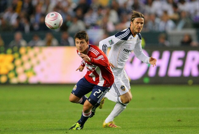 CARSON, CA - OCTOBER 16:  Ben Zemanski #21 of Chivas USA and David Beckham #23 of the Los Angeles Galaxy pursue the ball in the Chivas half of the field in the first half during the MLS match at The Home Depot Center on October 16, 2011 in Carson, California.  (Photo by Victor Decolongon/Getty Images)