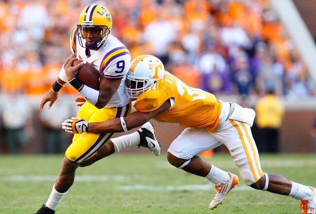 KNOXVILLE, TN - OCTOBER 15:  Jordan Jefferson #9 of the LSU Tigers rushes away from Brian Randolph #37 of the Tennessee Volunteers at Neyland Stadium on October 15, 2011 in Knoxville, Tennessee.  (Photo by Kevin C. Cox/Getty Images)