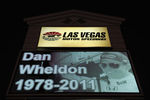 LAS VEGAS - OCTOBER 17:  A memorial to Dan Wheldon, driver of the #77 Bower & Wilkins Sam Schmidt Motorsports Dallara Honda, is displayed on a Las Vegas Motor Speedway sign on October 17, 2011 in Las Vegas, Nevada. Wheldon was killed during the Las Vegas Indy 300 part of the IZOD IndyCar World Championships presented by Honda at Las Vegas Motor Speedway on October 16, 2011. (Photo by Robert Laberge/Getty Images)