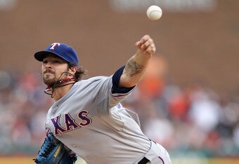 DETROIT, MI - OCTOBER 13:  C.J. Wilson #36 of the Texas Rangers throws a pitch against the Detroit Tigers in the first inning of Game Five of the American League Championship Series at Comerica Park on October 13, 2011 in Detroit, Michigan.  (Photo by Leon Halip/Getty Images)