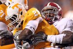 KNOXVILLE, TN - OCTOBER 23:  Tauren Poole #28 of the Tennessee Volunteers runs with the ball dwhile tackled by C.J. Mosley #32 of the Alabama Crimson Tide at Neyland Stadium on October 23, 2010 in Knoxville, Tennessee.  (Photo by Andy Lyons/Getty Images)