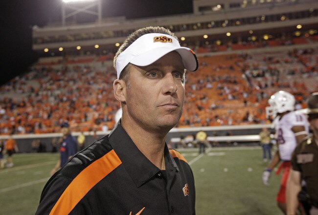 STILLWATER, OK - SEPTEMBER 8: Head Coach Mike Gundy of the Oklahoma State Cowboys looks across the field after the game against  the Arizona Wildcats on September 8, 2011 at Boone Pickens Stadium in Stillwater, Oklahoma.  Oklahoma State defeated Arizona 37-14.  (Photo by Brett Deering/Getty Images)