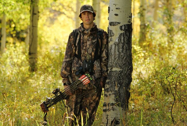 STEAMBOAT - SEPTEMBER 22:  Nordic combined skier Johnny Spillane walks with his bow near Buffalo Pass while searching for signs of elk on September 22, 2005 in Steamboat Springs, Colorado.  Spillane also lives in Park City, Utah.  (Photo by Brian Bahr/Getty Images)