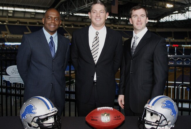 DETROIT , MI - JANUARY 16:  Jim Schwartz, center, head coach of the Detroit Lions poses with General Manager Martin Mayhew, left, and Tom Lewand team president after a press conference to introduce him as the Lions new head coach on January 16, 2009 at Ford Field in Detroit, Michigan.  (Photo by Gregory Shamus/Getty Images)