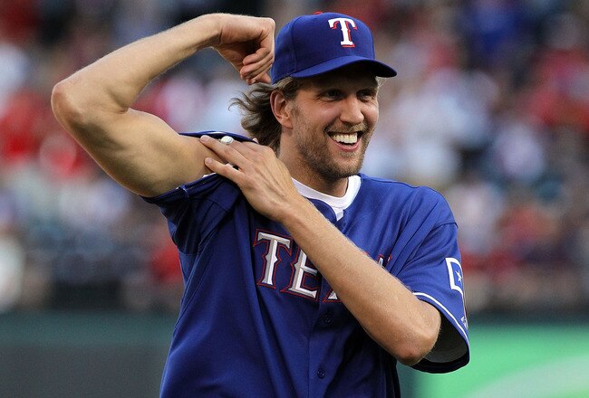 ARLINGTON, TX - JUNE 24:  Dirk Nowitzki of the Dallas Mavericks carries a NBA basketball before throwing out the ceremonial first pitch before a game between the New York Mets and the Texas Rangers at Rangers Ballpark in Arlington on June 24, 2011 in Arlington, Texas.  (Photo by Ronald Martinez/Getty Images)