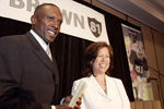 OAKLAND, CA - JULY 18:  Tim Brown and Oakland Raiders CEO Amy Trask smile during a press conference at the Grand Ballroom of the Oakland Airport Hilton on July 18, 2005 in Oakland, California. Brown announced his retirement from professional football after signing a one day contract with the Oakland Raiders.  (Photo by David Paul Morris/Getty Images)