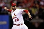 ST LOUIS, MO - OCTOBER 19:  Chris Carpenter #29 of the St. Louis Cardinals pitches in the first inning during Game One of the MLB World Series against the Texas Rangers at Busch Stadium on October 19, 2011 in St Louis, Missouri.  (Photo by Rob Carr/Getty Images)