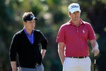 LAKE BUENA VISTA, FL - OCTOBER 20:  Luke Donald of England (L) and Webb Simpson wait to play a shot on the 18th hole during the first round of the Children's Miracle Network Classic at the Disney Palm and Magnolia course on October 20, 2011 in Lake Buena Vista, Florida.  (Photo by Sam Greenwood/Getty Images)