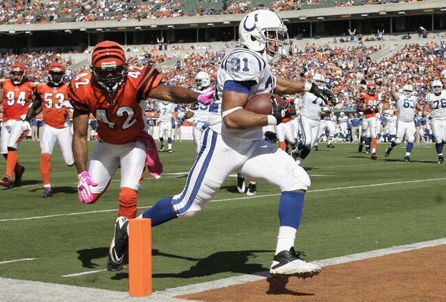 CINCINNATI, OH - OCTOBER 16:  Donald Brown #31 of the Indianapolis Colts scores a touchdown in front of Chris Crocker #42 of the Cincinnati Bengals during their game at Paul Brown Stadium on October 16, 2011 in Cincinnati, Ohio.  The Bengals defeated the Colts 27-17. (Photo by John Grieshop/Getty Images)