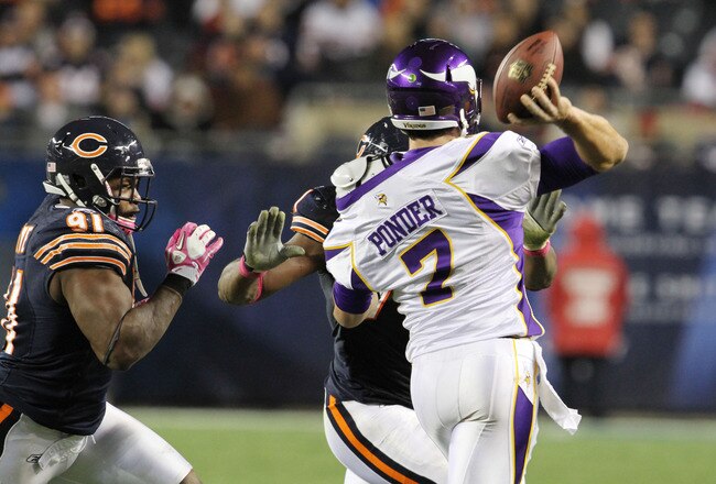 CHICAGO, IL - OCTOBER 16: Amobi Okoye #91 and Israel Idonije #71 of the Chicago Bears tackles Christian Ponder #7 of the Minnesota Vikings at Soldier Field on October 16, 2011 in Chicago, Illinois.  (Photo by Tasos Katopodis /Getty Images)