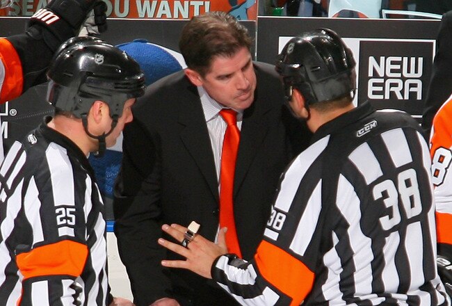 BUFFALO, NY - APRIL 20:  Head coach Peter Laviolette of the Philadelphia Flyers argues a penalty call with referee Francois St. Laurent #38 aginst the Buffalo Sabres  in Game Four of the Eastern Conference Quarterfinals during the 2011 NHL Stanley Cup Playoffs at HSBC Arena at HSBC Arena on April 20, 2011 in Buffalo, New York.  (Photo by Rick Stewart/Getty Images)