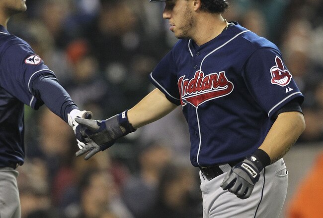 DETROIT - SEPTEMBER 28: Asdrubal Cabrera #13 of the Cleveland Indians is congratulated by teammate Matt LaPorta #7 after scoring on a single to left center field off the bat of Jack Hannahan of the Detroit Tigers during the fifth inning of the game at Comerica Park on September 28, 2011 in Detroit, Michigan.  (Photo by Leon Halip/Getty Images)