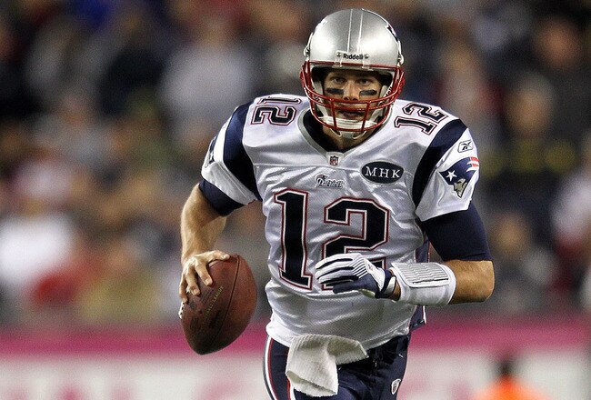 FOXBORO, MA - OCTOBER 16:  Tom Brady #12 of the New England Patriots scrambles during a game against the New England Patriots in the second half at Gillette Stadium on October 16, 2011 in Foxboro, Massachusetts. (Photo by Jim Rogash/Getty Images)
