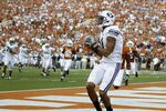 AUSTIN, TX - SEPTEMBER 10:  Wide receiver Ross Apo #11 of the BYU Cougars catches a second quarter touchdown pass by Jake Heaps against the Texas Longhorns on September 10, 2011 at Darrell K. Royal-Texas Memorial Stadium in Austin, Texas.  (Photo by Erich Schlegel/Getty Images)