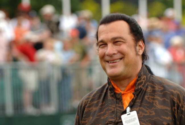 UNITED STATES - MAY 29:  Steven Seagal smiles after missing his putt for charity during the Final Round of The Fedex St. Jude Classic at TPC @ Southwind in Memphis, Tennessee on May 29, 2005.  (Photo by Joe Murphy/Getty Images)