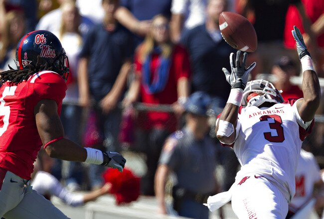 OXFORD,  MS - OCTOBER 22:   Joe Adams #3 of the Arkansas Razorbacks catches a pass at the goal line over Frank Crawford #5 of the Ole Miss Rebels at Vaught-Hemingway Stadium on October 22, 2011 in Oxford, Mississippi.  The Razorbacks defeated the Rebels 29 to 24.  (Photo by Wesley Hitt/Getty Images)