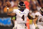 CHARLOTTE, NC - SEPTEMBER 03:  Dominique Davis #4 of the East Carolina Pirates drops back to pass against the South Carolina Gamecocks during their game at Bank of America Stadium on September 3, 2011 in Charlotte, North Carolina.  (Photo by Streeter Lecka/Getty Images)