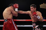 NEW YORK - OCTOBER 22: (R-L) Nonito Donaire of the Philippines connects with a right to Omar Narvaez of Argentina in the WBC, WBO World Bantamweight Titles bout at Madison Square Garden on October 22, 2011 in New York City.  (Photo by Chris Trotman/Getty Images)