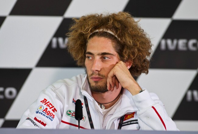 PHILLIP ISLAND, AUSTRALIA - OCTOBER 15:  Marco Simoncelli of Italy and San Carlo Honda Gresini looks on during the press conference  at the end of the qualifying practice for the Australian MotoGP, which is round 16 of the MotoGP World Championship, at Phillip Island Grand Prix Circuit on October 15, 2011 in Phillip Island, Australia.  (Photo by Mirco Lazzari gp/Getty Images)