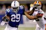 INDIANAPOLIS, IN - SEPTEMBER 18:  Joseph Addai #29 of the Indianapolis Colts carries the ball against Joe Haden #23 of the Cleveland Browns at Lucas Oil Stadium on September 18, 2011 in Indianapolis, Indiana.  (Photo by Matthew Stockman/Getty Images)