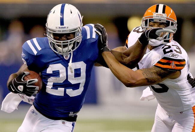 INDIANAPOLIS, IN - SEPTEMBER 18:  Joseph Addai #29 of the Indianapolis Colts carries the ball against Joe Haden #23 of the Cleveland Browns at Lucas Oil Stadium on September 18, 2011 in Indianapolis, Indiana.  (Photo by Matthew Stockman/Getty Images)