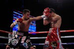 NEW YORK - OCTOBER 22: (L-R) Nonito Donaire of the Philippines connects with a left to Omar Narvaez of Argentina in the WBC, WBO World Bantamweight Titles bout at Madison Square Garden on October 22, 2011 in New York City.  (Photo by Chris Trotman/Getty Images)