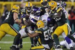 GREEN BAY, WI - OCTOBER 24:  Adrian Peterson #28 of the Minnesota Vikings is stopped by Desmond Bishop #55 of the Green Bay Packers at Lambeau Field on October 24, 2010 in Green Bay, Wisconsin. (Photo by Jim Prisching/Getty Images)