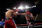 NEW YORK - OCTOBER 22: (R-L)  Nonito Donaire of the Philippines connects with a right to Omar Narvaez of Argentina in the WBC, WBO World Bantamweight Titles bout at Madison Square Garden on October 22, 2011 in New York City.  (Photo by Chris Trotman/Getty Images)