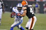 CLEVELAND, OH - AUGUST 19: Jerome Harrison #36 of the Detroit Lions rushes for a first down against Raymond Ventrone #41 of the Cleveland Browns during the third quarter at Cleveland Browns Stadium on August 19, 2011 in Cleveland, Ohio. The Tigers defeated the Browns 30-28. (Photo by Jason Miller/Getty Images)