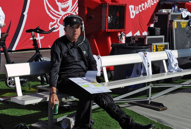 TAMPA, FL - OCTOBER 16:  Coach Sean Payton of the New Orleans Saints directs play from the bench after injuring his leg in a sideline collision against the Tampa Bay Buccaneers October 16, 2011 at Raymond James Stadium in Tampa, Florida. (Photo by Al Messerschmidt/Getty Images)