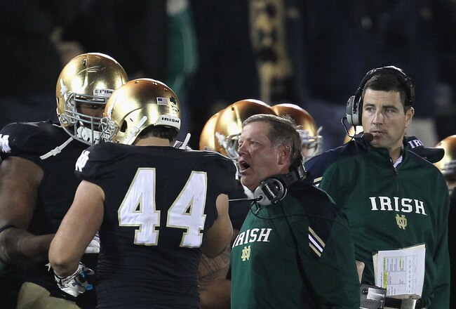 SOUTH BEND, IN - OCTOBER 22:  Head coach Brian Kelly of the Notre Dame Fighting Irish yells at Carlo Calabrese #44 after a penalty during a game against the University of Southern California Trojans at Notre Dame Stadium on October 22, 2011 in South Bend, Indiana.  (Photo by Jonathan Daniel/Getty Images)