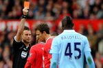 MANCHESTER, ENGLAND - OCTOBER 23:  Referee  Mark Clattenburg shows a red card to Jonny Evans of Manchester United during the Barclays Premier League match between Manchester United and Manchester City at Old Trafford on October 23, 2011 in Manchester, England.  (Photo by Laurence Griffiths/Getty Images)
