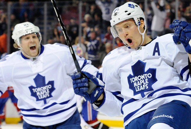 MONTREAL, CANADA - OCTOBER 22:  Mikhail Grabovski #84 of the Toronto Maple Leafs celebrates after scoring the game winning goal in overtime during the NHL game against the Montreal Canadiens at the Bell Centre on October 22, 2011 in Montreal, Quebec, Canada.  The Maple Leafs defeated the Canadiens 5-4 in overtime.  (Photo by Richard Wolowicz/Getty Images)