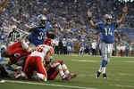 DETROIT, MI - SEPTEMBER 18:  Keiland Williams #34 of the Detroit Lions and teammate Shaun Hill #14 celebrate a touchdown in front of Andy Studebaker #96 of the Kansas City Chiefs during a NFL game at Ford Field on September 18, 2011 in Detroit, Michigan.  The Lions won 48-3  (Photo by Dave Reginek/Getty Images)